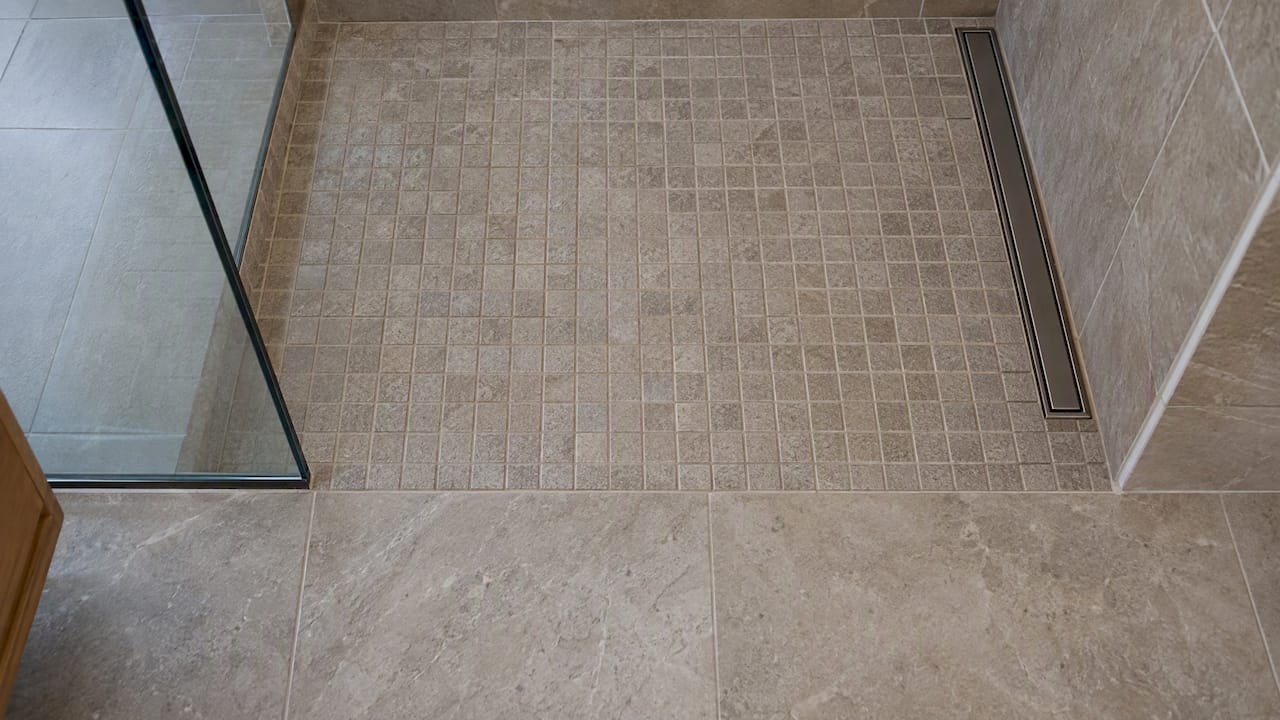 Porcelain tile transition in curbless shower