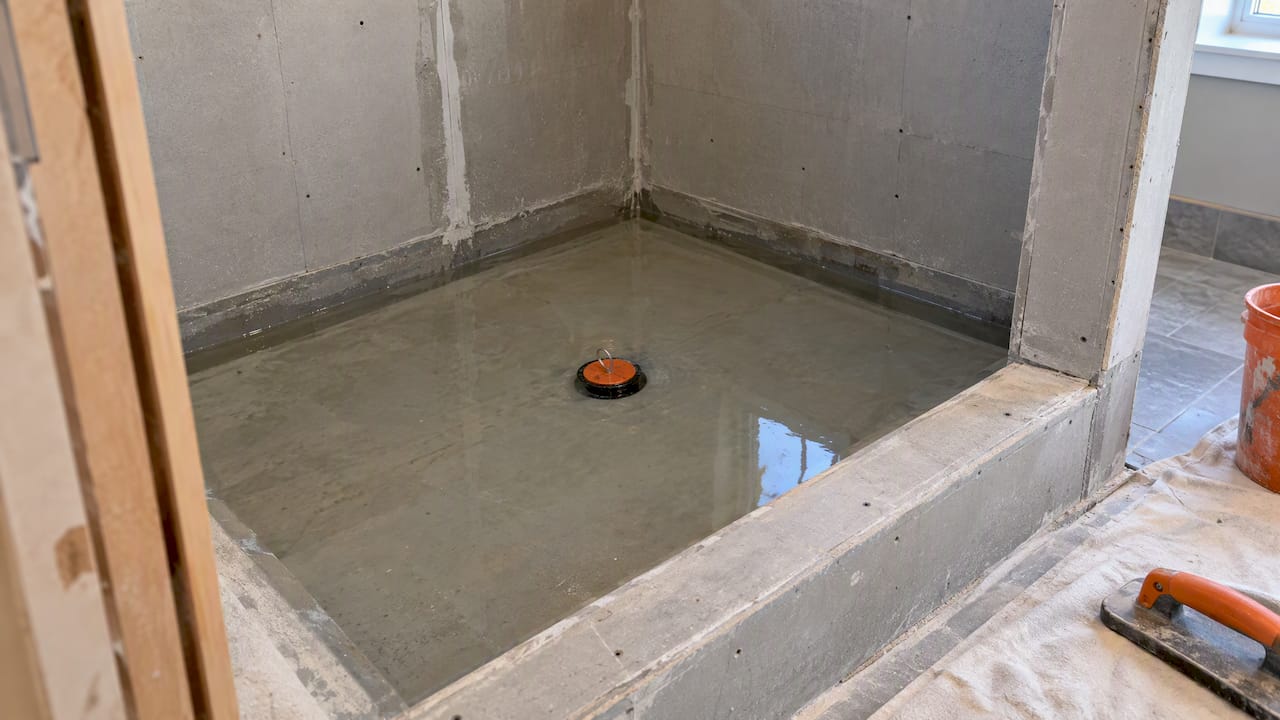1791007552561_Water-filled-shower-pan-during-flood-test | The Bath & Kitchen Gallery Water-filled shower pan during flood test
