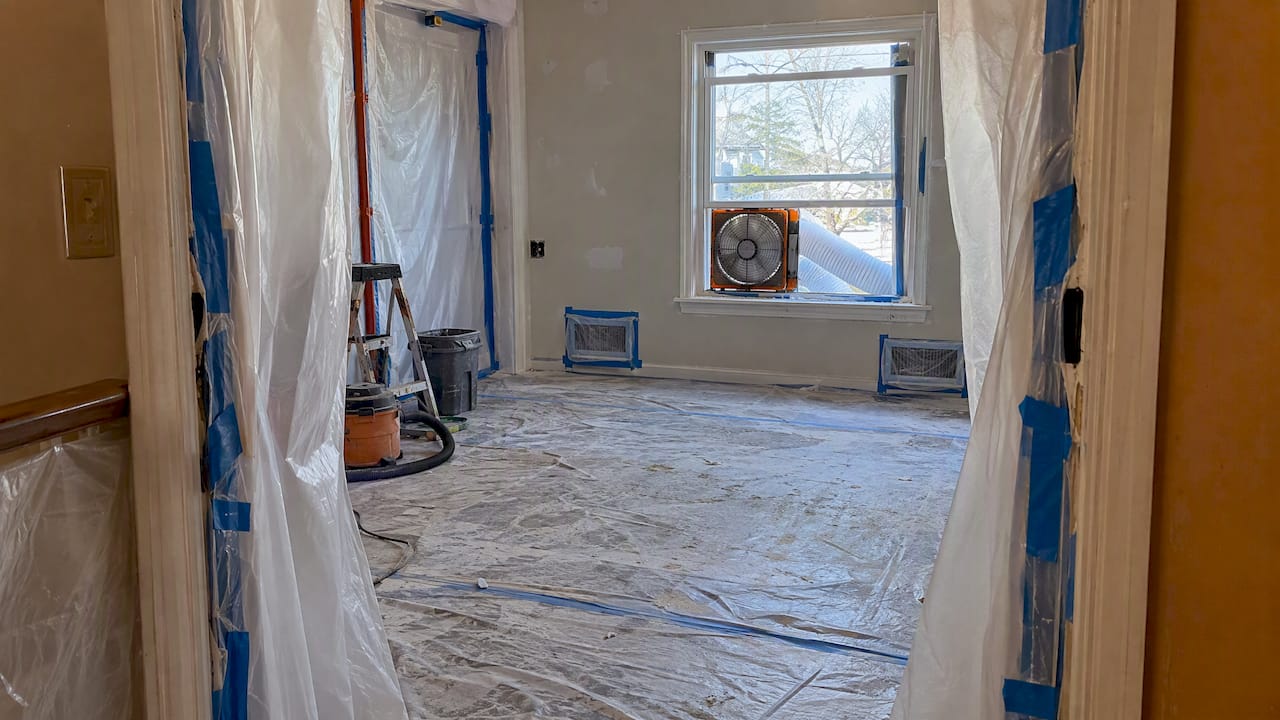 Sealed remodel room with exhaust fan