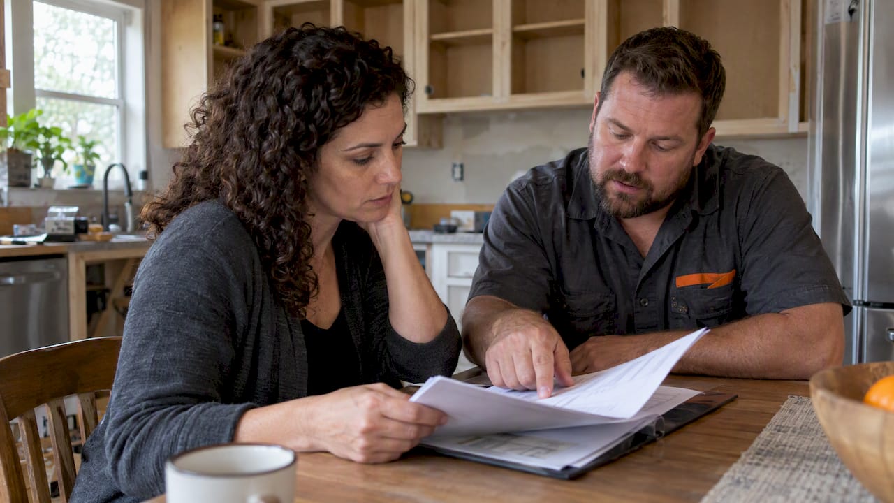 Homeowner reviewing remodeling allowance paperwork