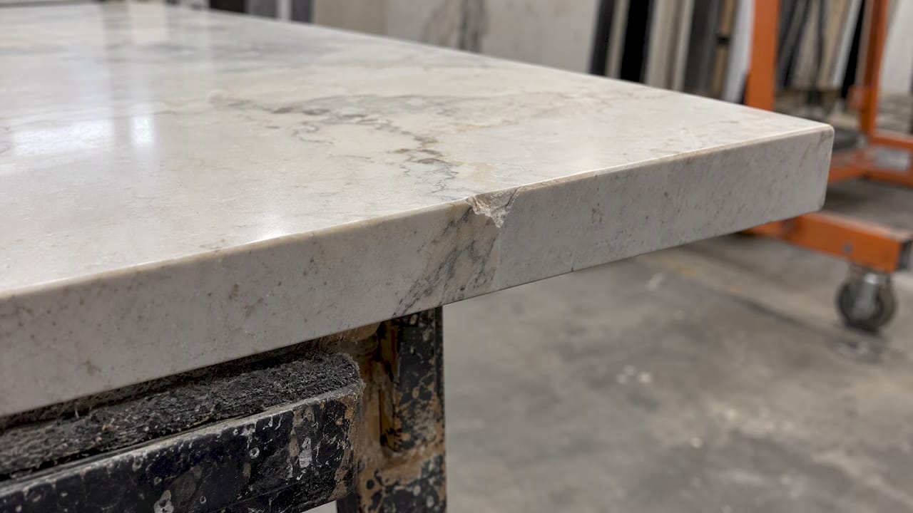 Small chip revealing a sintered stone edge